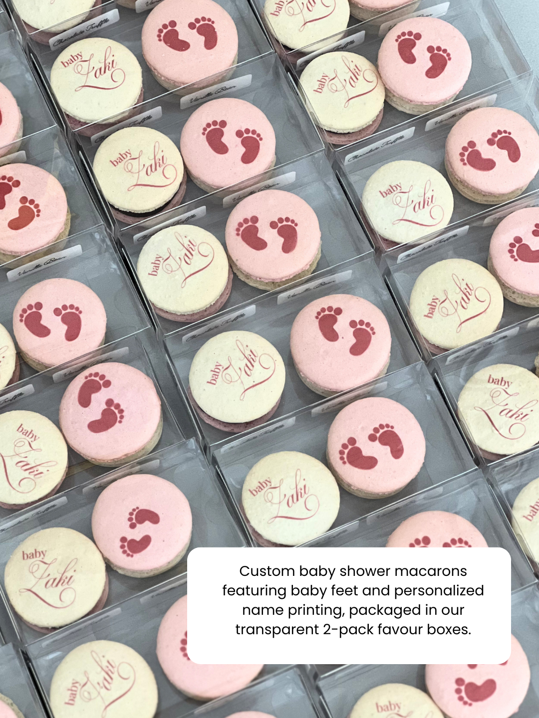 Custom baby shower macarons featuring baby feet and personalized name printing, packaged in our transparent 2-pack favour boxes.